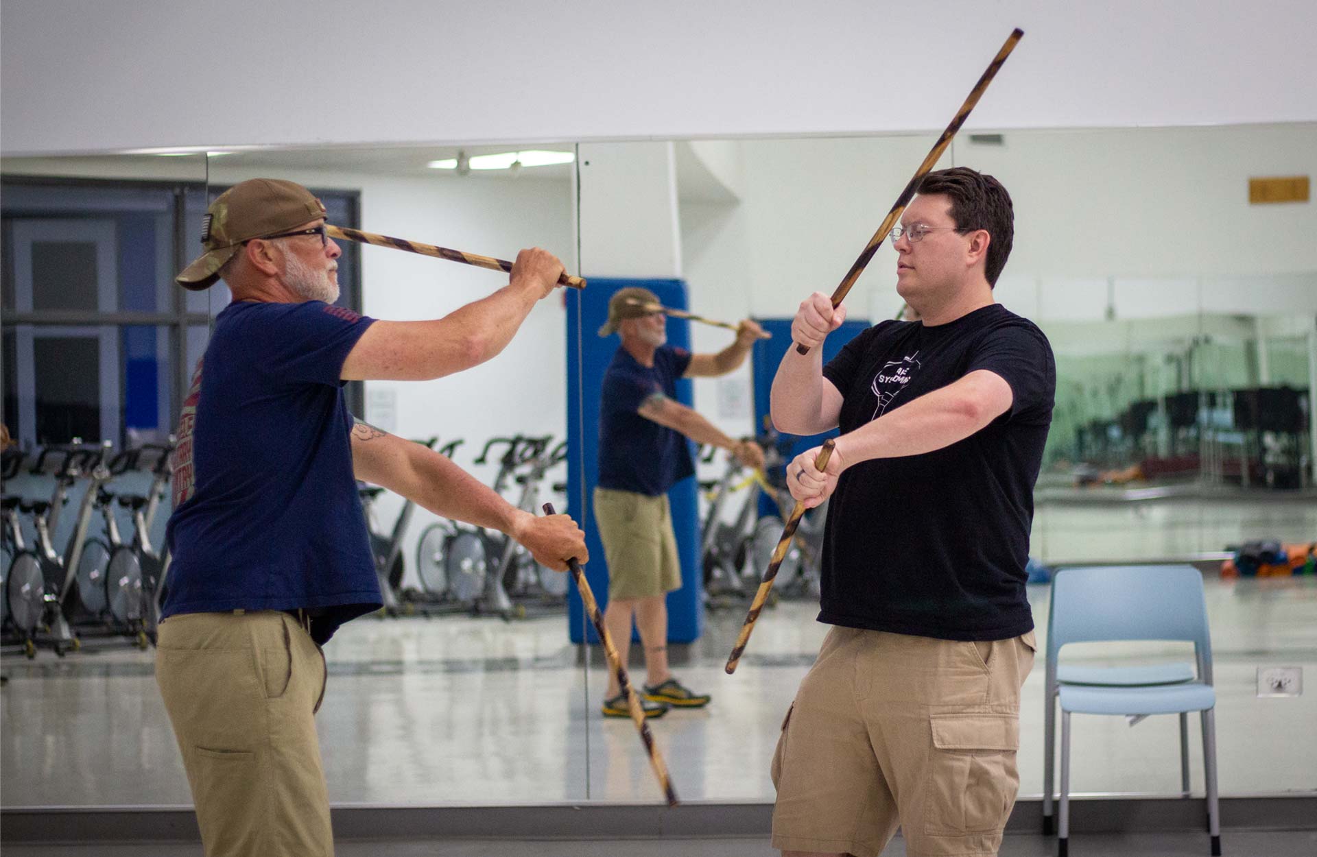 Two white males in Modern Arnis class