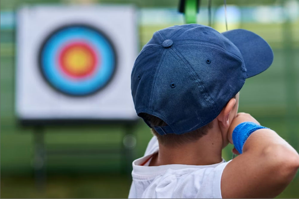 boy with bow and arrow