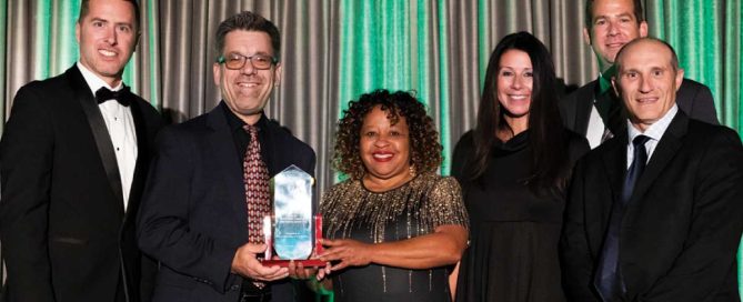 Multiple people accepting award