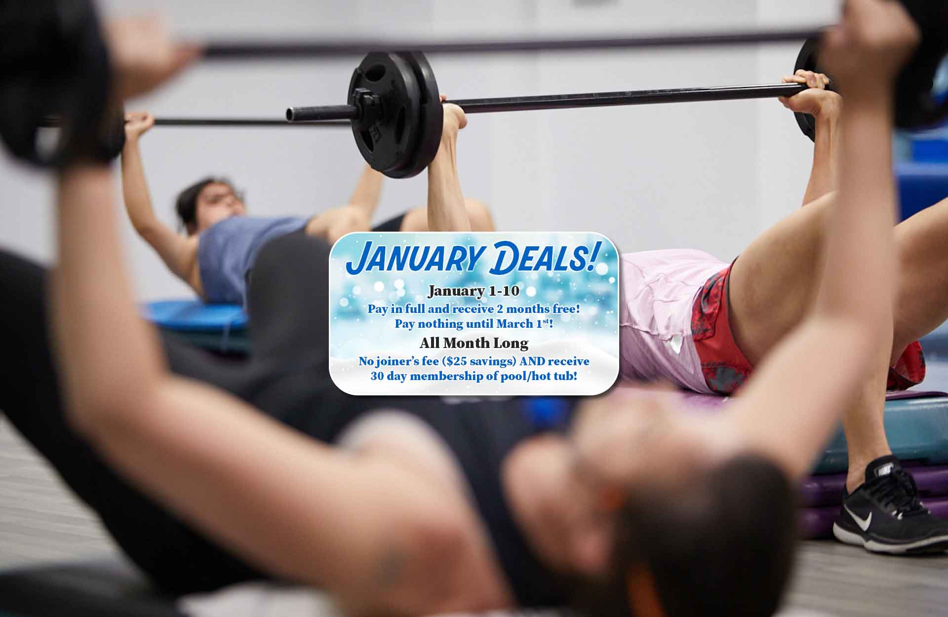 Various women lifting weights in group fitness class