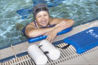 Adult Asian woman at edge of pool