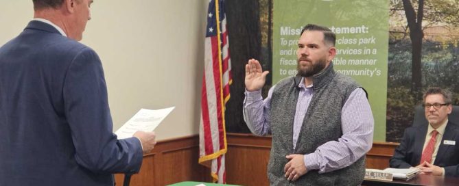Middle-aged white male swearing in as board member