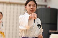 Young Asian girl punching