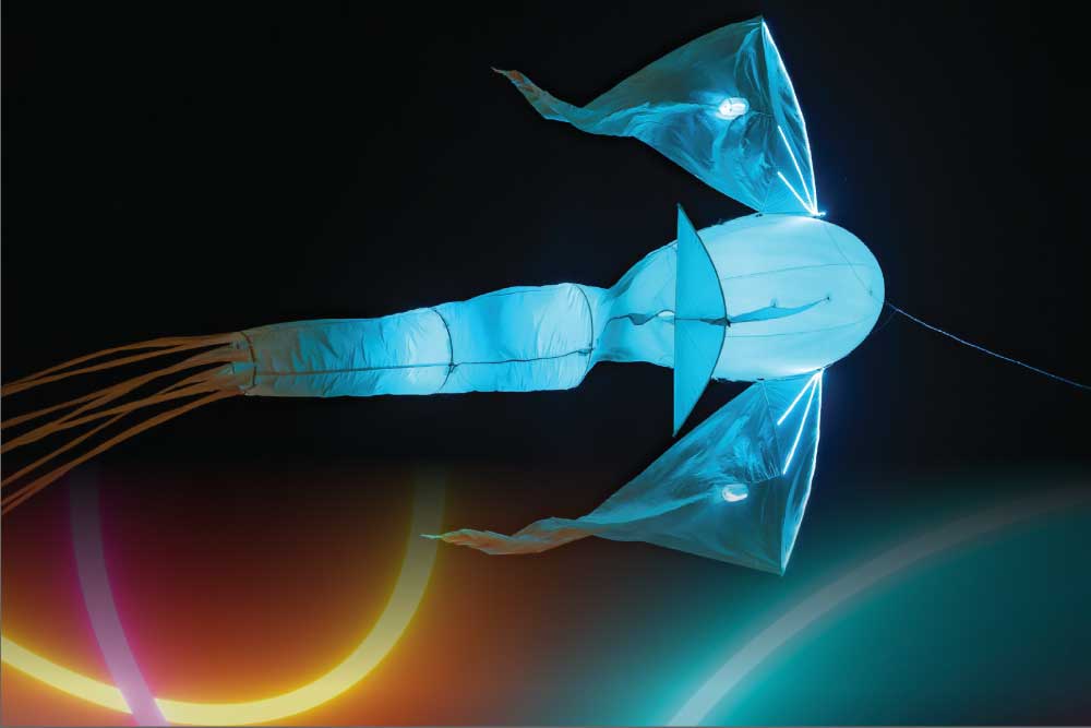 Blue glowing kite in the night sky