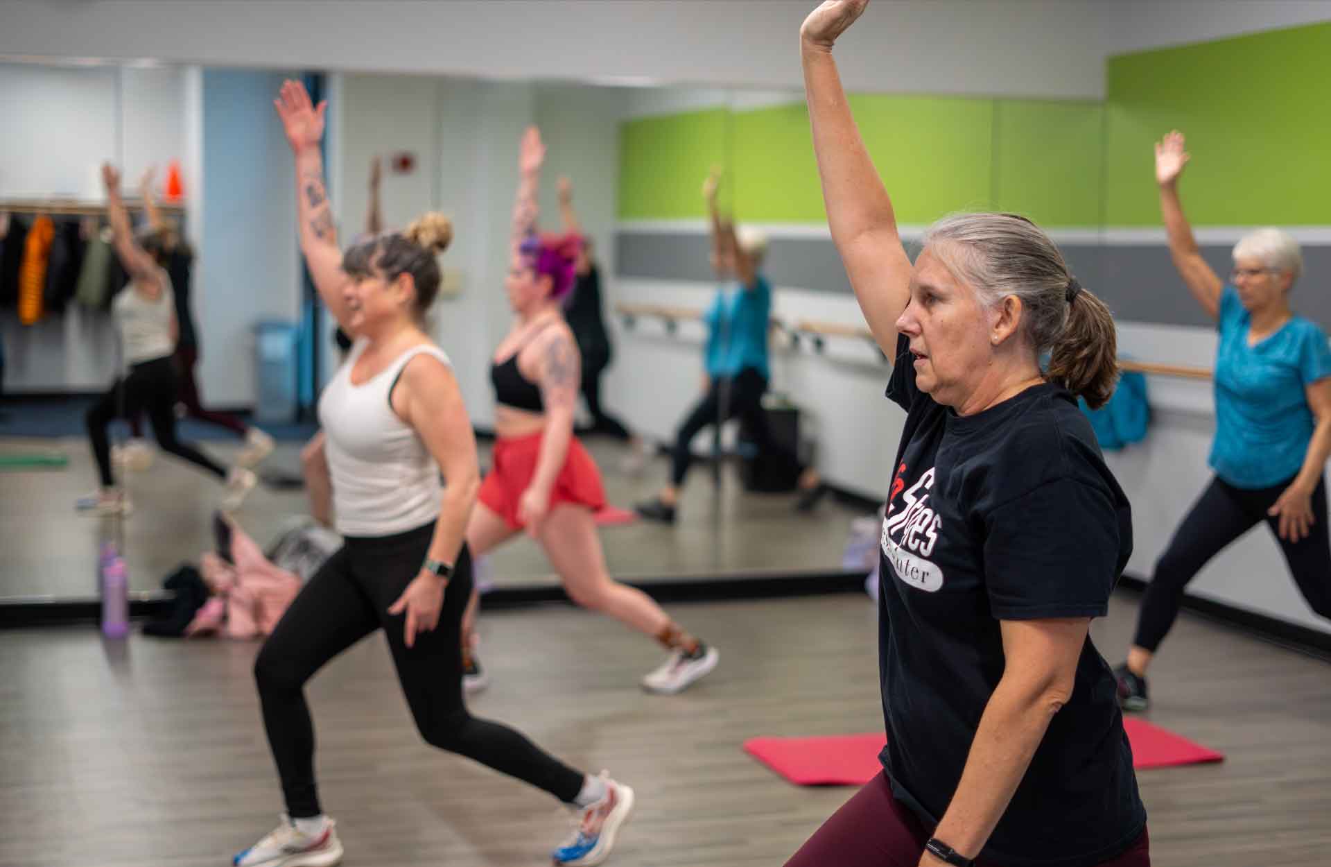 Group of middle-aged Caucasian women participating in a group fitness class