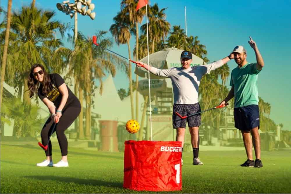 2 men and a woman playing bucket golf
